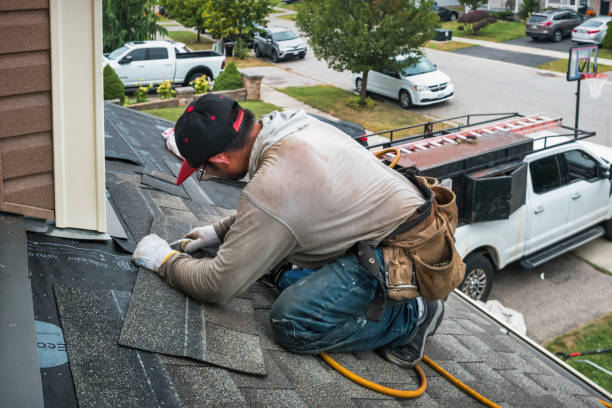 Professional Storm Damage Roof Repair technician working in Fort Loramie, OH